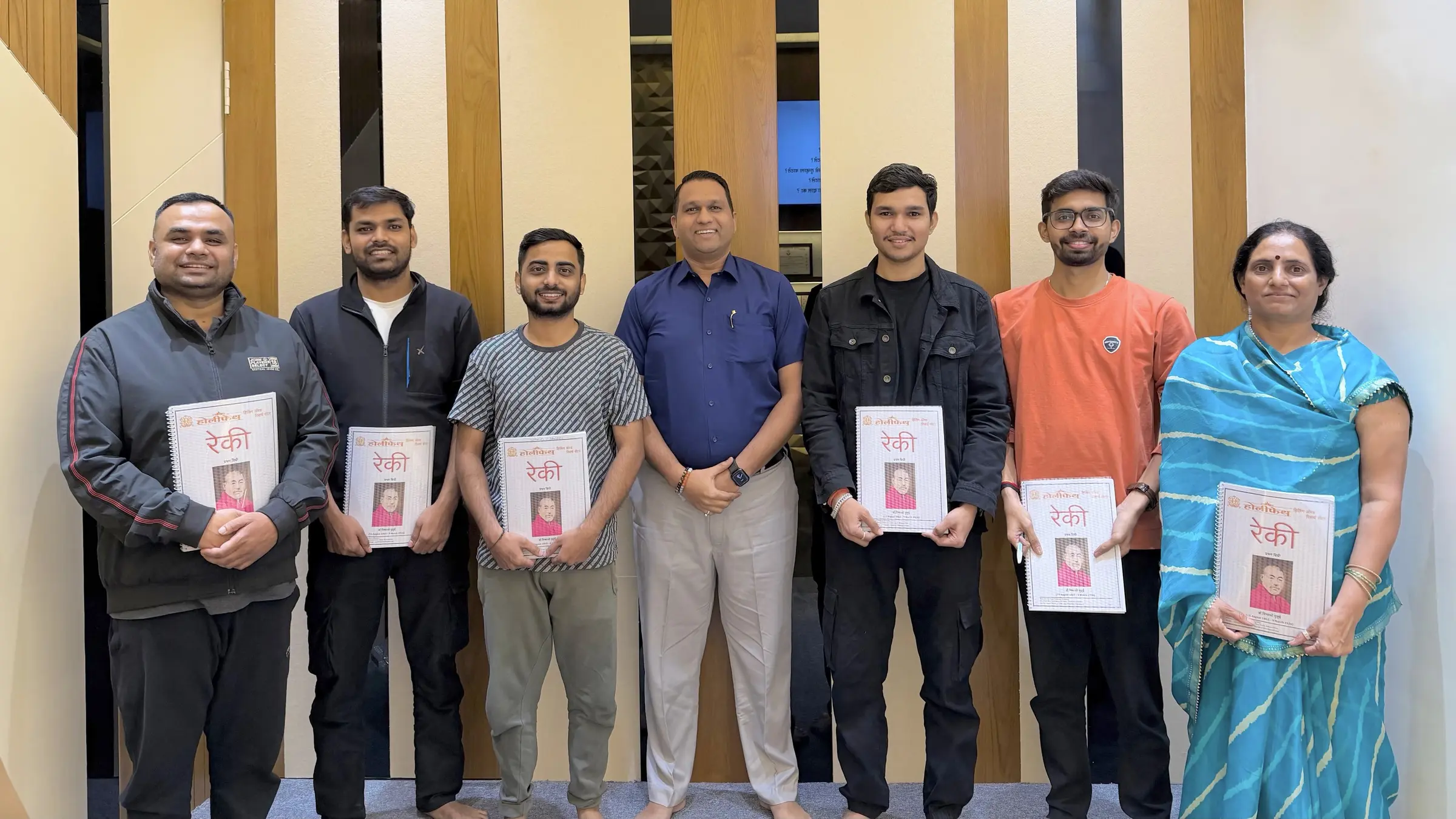 HolyFaith Reiki students with their course material